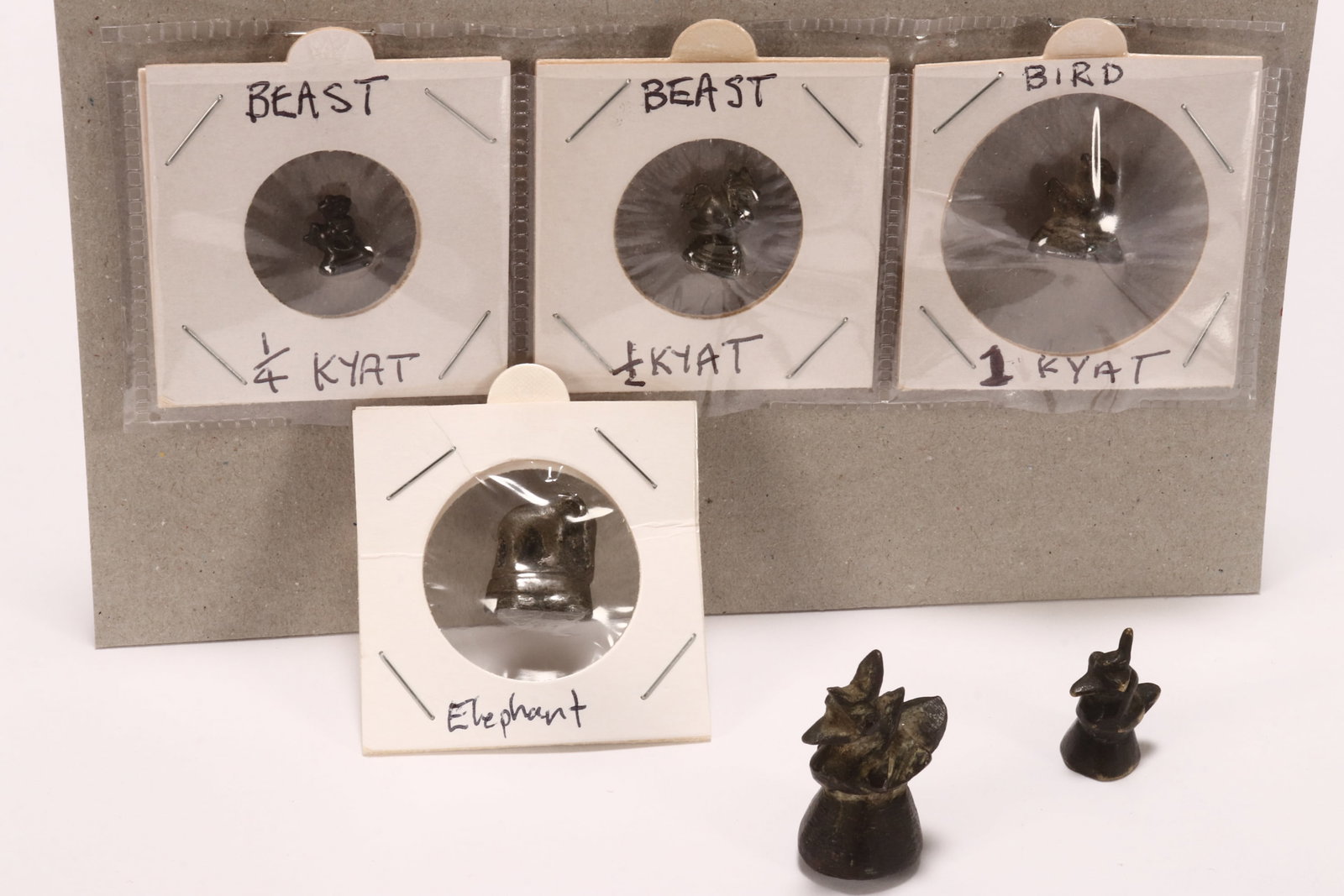 Six Small Burmese Bronze Opium Weights,: in the rare 1/4 and 1/2 and 1 Kyat, in the form of birds and an elephant (6)