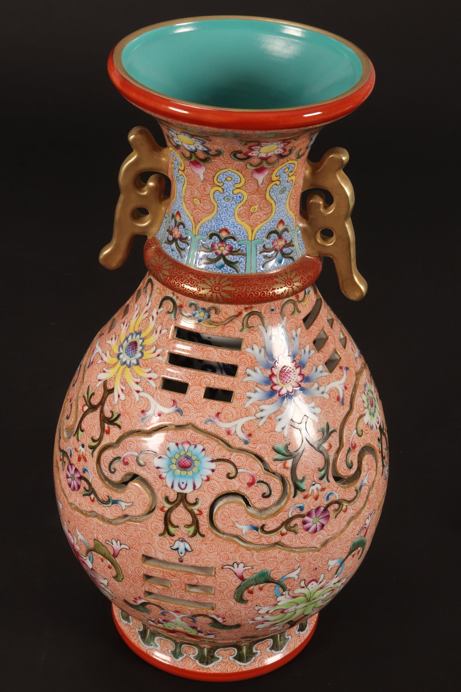 Chinese Reticulated Porcelain Vase,: of pear form, set with stylised twin handles, decorated with continuous lotus and foliage, in colourful tones, pierced with ruyi head and trigrams, with inner cylindrical sleeve, part decorated with b
