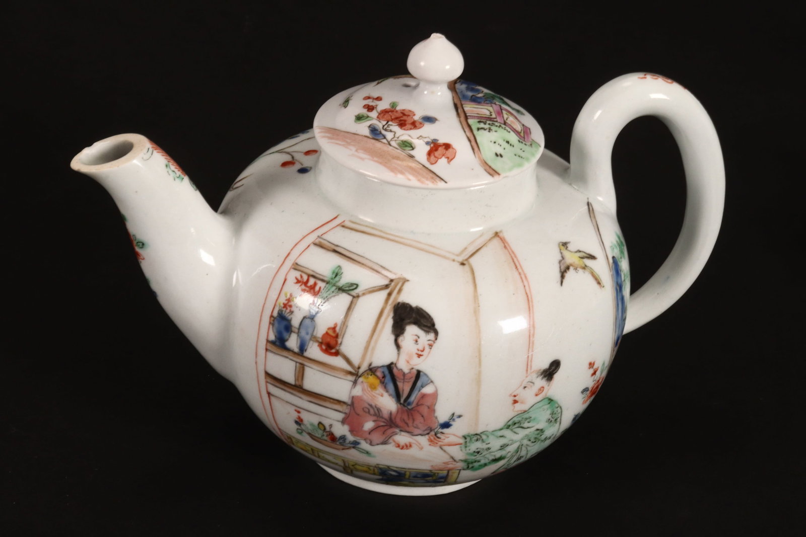 Chinese Porcelain Teapot and Cover,: of globular form, decorated with village scene depicting a figure selling flowers, with a scene of a bird surrounded by flowers and foliage to verso, with floral and foliate motifs to spout, in tones 