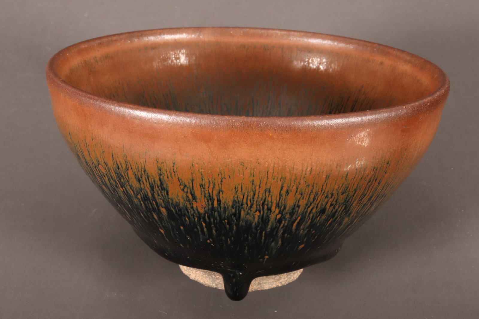 Chinese Hare's Fur Glaze Bowl,: of conical form, decorated with a mottled black and brown glaze, standing on an exposed circular foot, two character mark to base, height 7cm and diameter 12.5cm
