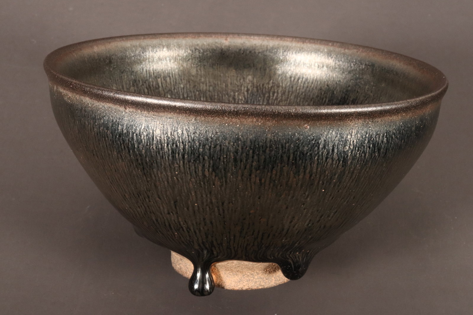 Chinese Hare's Fur Glaze Bowl,: of conical form with slightly flared rim, decorated with a mottled black and silver glaze, standing on an exposed circular foot, two character mark to base, height 7cm and diameter 12.5cm