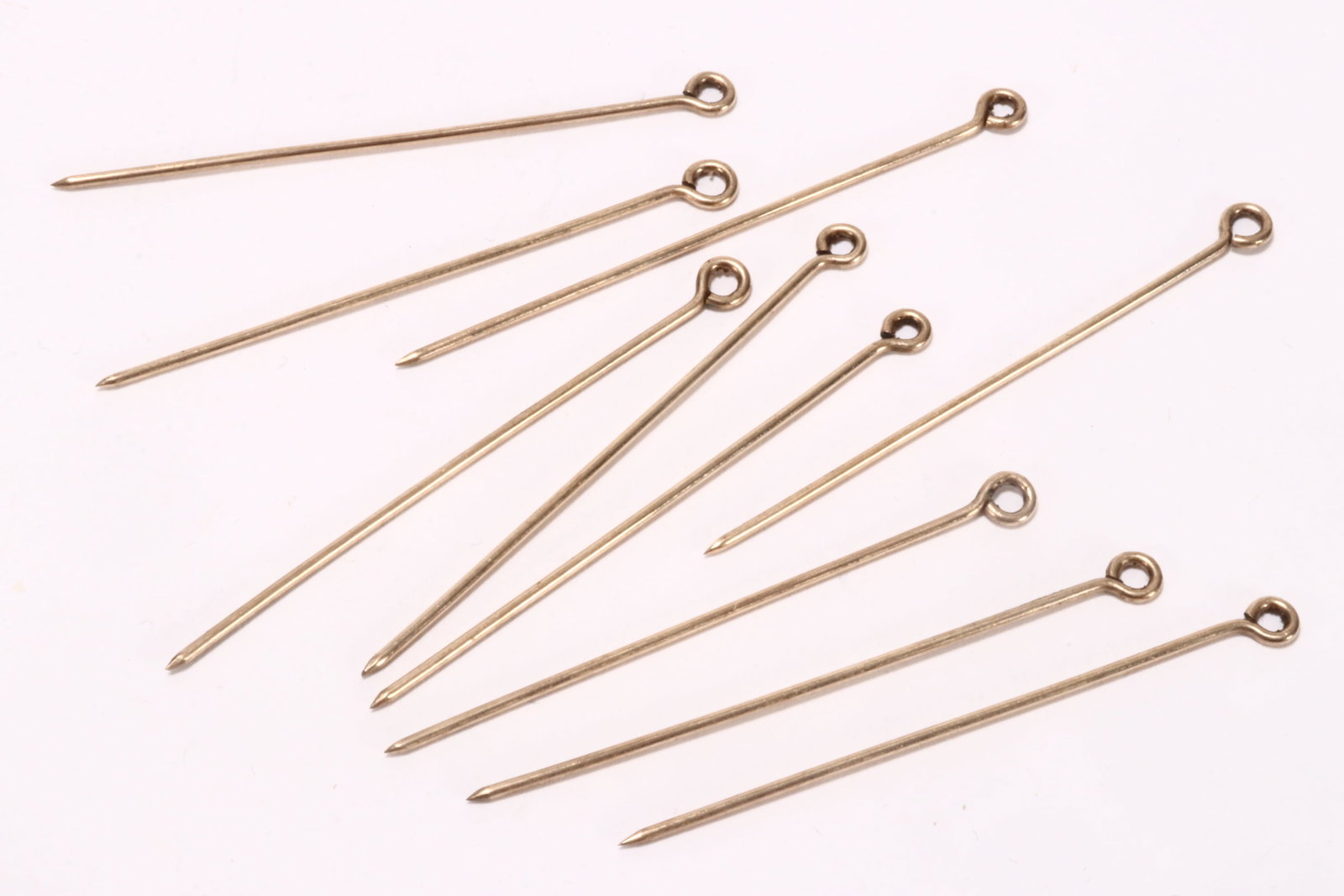 Set of Ten 14ct Yellow Gold Eye Pins,: unmarked (tested as 14ct), total weight 5.14g, length 53mm (10)