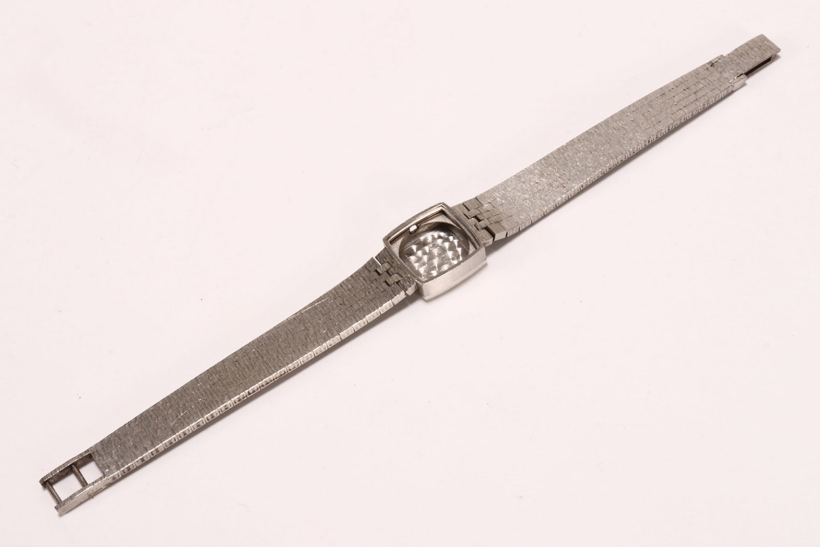 Ladies 18ct White Gold Watch Case,: marked 18ct to case back, the band testing 9ct, total weight 27.7g, length 17cm