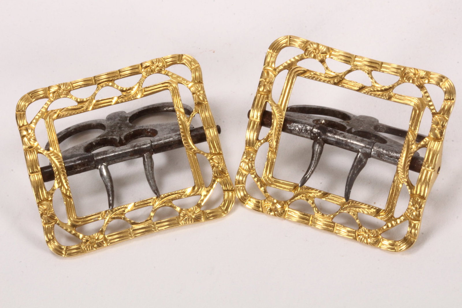 Pair of George III Gold Pierced Buckles,: by Thomas Taylor I, London, c.1775, minimum fineness 18ct, of rectangular form, with double reeded borders, united by foliate and flower head motifs, with steel mounts, total weight 20g, 3.3cm x 3cm (
