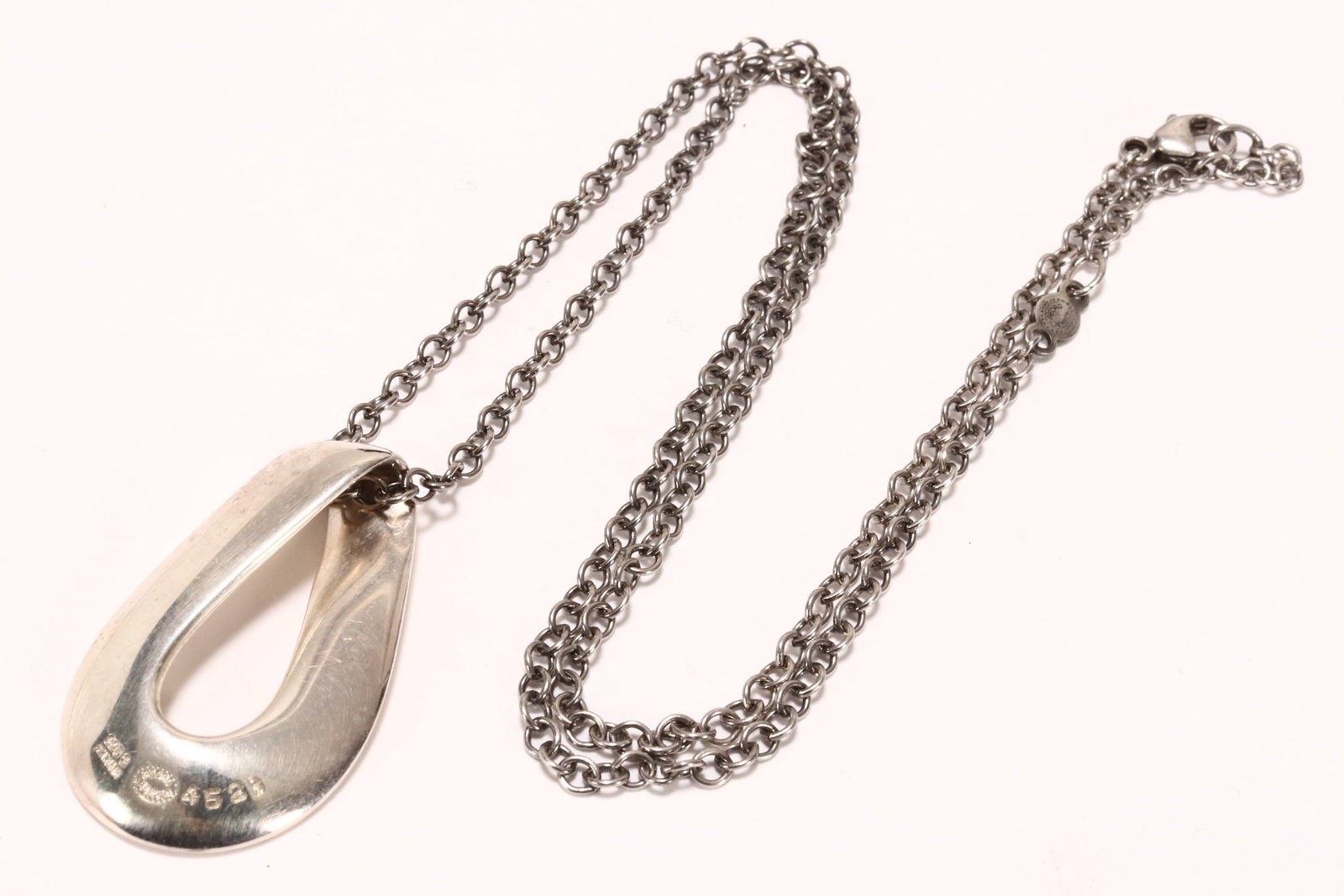 Georg Jensen 'Infinity' Sterling Silver Pendant,: designed by Regitze Overgaard, stamped 925S, #452B, pendant length 30mm, suspended on original Georg Jensen sterling silver chain of 44cm total length, total silver weight 11.2g, in original fitted pr