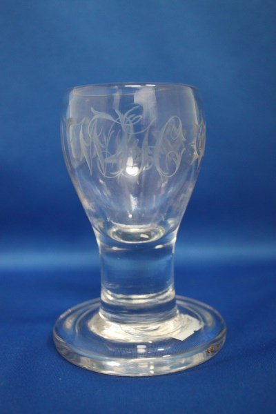 Edwardian Masonic Toasting Glass,: of solid form, decorated with engraved Masonic emblems and monogram, h 11.5cm