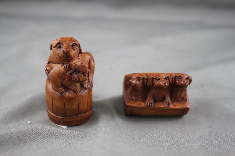 Two Boxwood Netsukes of Dogs,: signed (2)