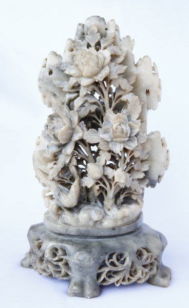 Chinese Carved Soapstone Figure Group,: carved in the form of flowers and foliage, amongst rocky outcrop with a bird perched below, h 26cm Provenance: This item is one of the several HENG Family's collections of Chinese Antiques and other f
