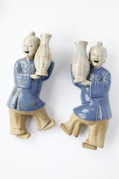 Pair of Chinese Incense Wall Burners,: in the form of two figures holding vases in each hand, wearing blue glazed coats, a/f. h 20.5cm