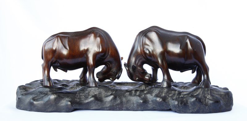 Pair of Chinese Carved Wooden Ox,: depicted with horns locked, and set with glass eyes, on carved wooden stand, l 30cm