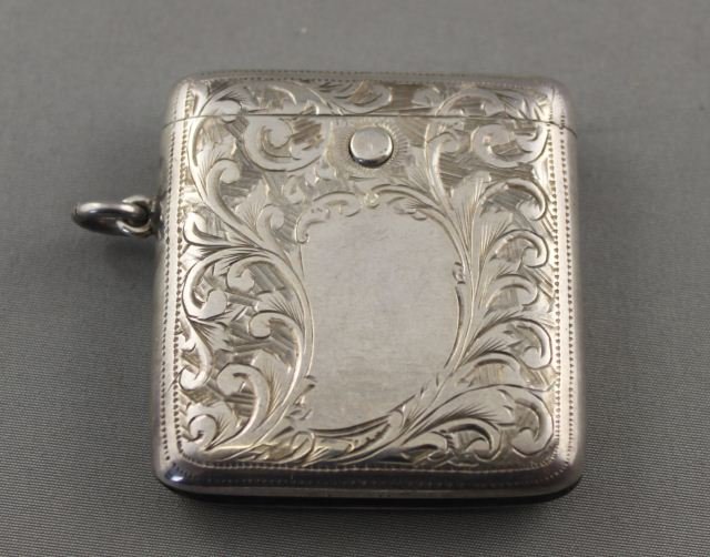 Edwardian Sterling Silver Vesta Case,: hallmarked, Birmingham, 1908, G.L with a push button opener engraved with a scrolling acanthus motif, h 5cm