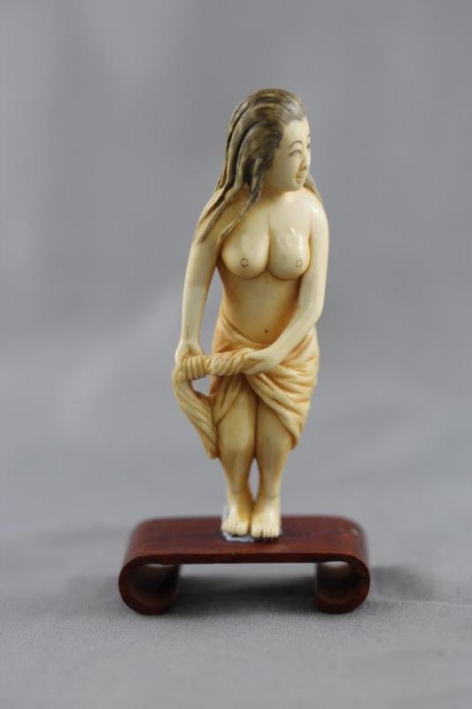 Japanese Ivory Netsuke,: carved in the form of a washing women, on stand, a/f, h 9cm Provenance: Mrs Betty Nelson Estate, Hong Kong 1947-1967