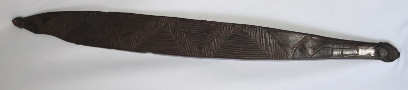 19th Century Aboriginal ‘Woomera’,: from the Western desert region, of slender leaf form with etched geometric surface, good patina, l 65cm
