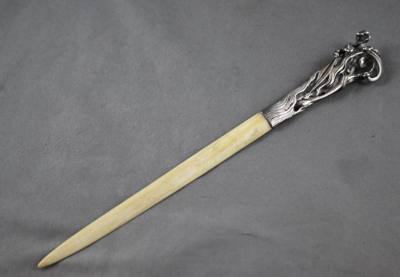 Good Art Nouveau Silver and Ivory Letter Opener,: the handle in the form of a maiden with flowing hair amongst flowers, stamped 925, l 19cm