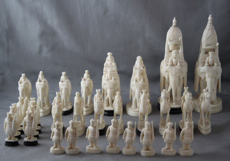 Wonderful Indian Ivory Chess Set,: carved in the form of figures riding on the back of elephants and soldiers