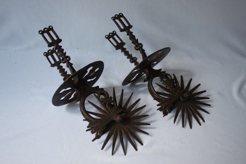 Pair of 19th Century South American Iron Spurs,: with twenty prick rondels and ornate iron work