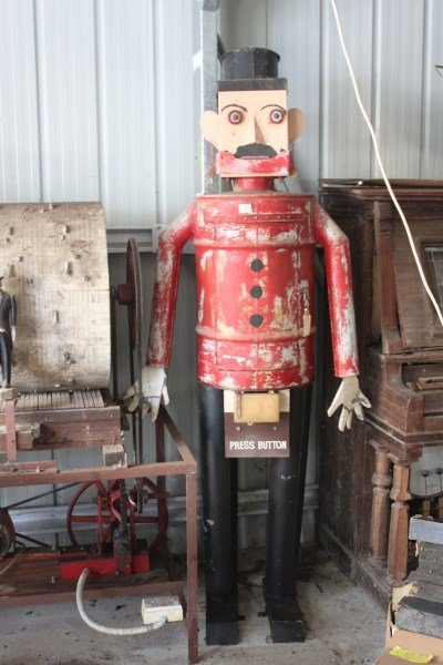 Ned Kelly Automaton,: in metal in painted red and black finish Purchased: Tim Goodman Auctions