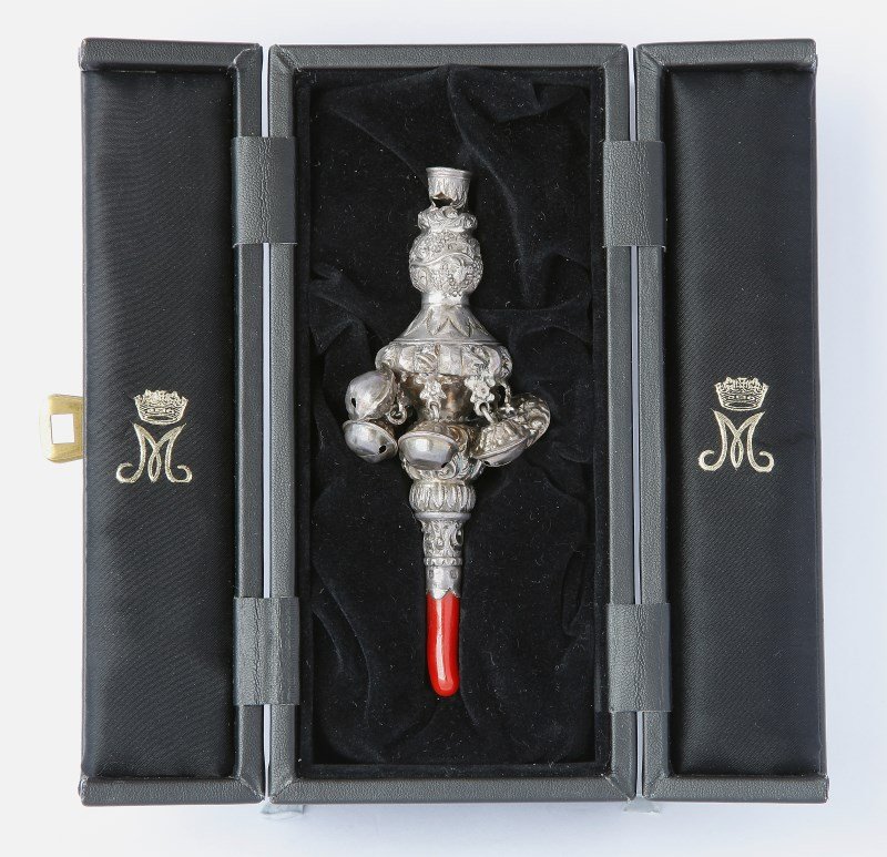 Wonderful George IV Sterling Silver and Coral: Child's Rattle, hallmarked Birmingham, 1827, George Unite, of baluster form, decorated with foliage and scrolls, suspending eight bells and with a whistle terminal, with a later coral teether, marked 