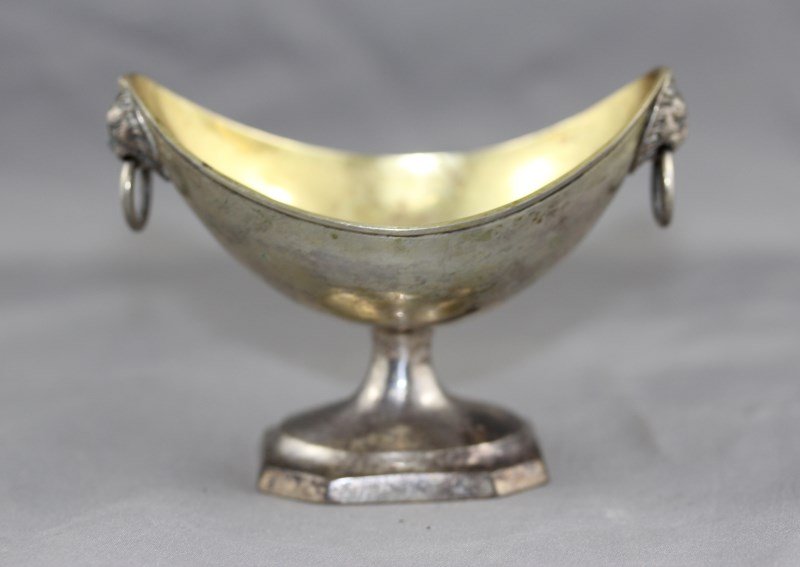 Russian Silver and Gilt Twin Handled Salt: of navene form, with mask drop ring handles on a square foot, l 9.5cm