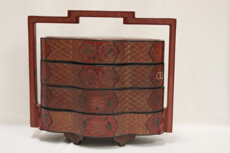 Chinese Lacquered Four Tier Food: Basket, decorated with the precious buddhist emblems, in tones of red and black, h 31cm