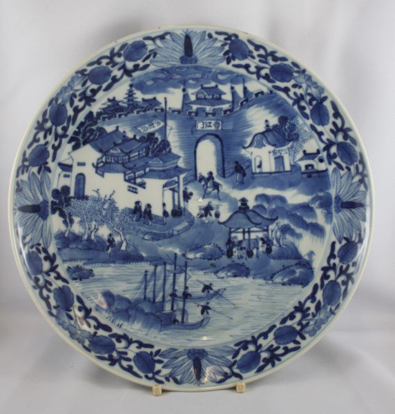 Chinese Qing Dynasty Blue and White Porcelain: Plate, of circular form, decorated with figures outside walled palace, d 24cm Provenance: Lucas Collection, Director Asian Art Institute of Australia
