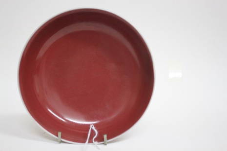 Good Chinese Sang de Beouf Dish,: of circular form with sloping sides, with white glaze rim, on a circular foot, six character mark to base, d 18cm Purchased: I.M Chait, then Private Collection