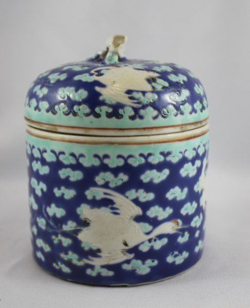 Chinese Porcelain Box and Cover,: of cylindrical form, decorated with storks amongst cloud scrolls, in tones of blue, turquoise and white, seal mark to base, h 9cm Provenance: Lucas Collection, Director Asian Art Institute of Australi