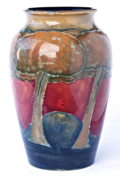 William Moorcroft Vase, c.1925,: in "Eventide" pattern with stylized trees within an undulating landscape in russet tones of browns, greens, and red impressed Made in England Moorcroft and script signature, a/f, h 16 cm