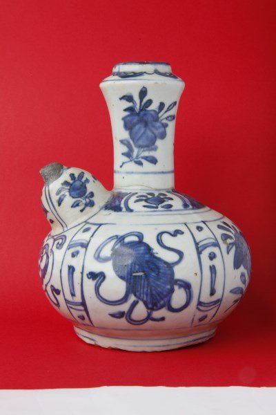 Chinese Early Qing Dynasty Blue and White Kendi,: of baluster form, decorated with panels of buddhist precious emblems, a/f,repair to neck and spout, h 19cm, Provenance: Estate of the Late Dr Josef & Mrs Edith Peukert