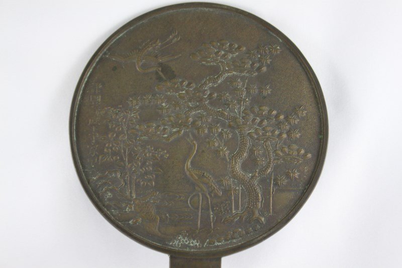 Chinese Cast Bronze Mirror,: depicting cranes, tortoise, trees and a stream with inscription, h 24.5cm