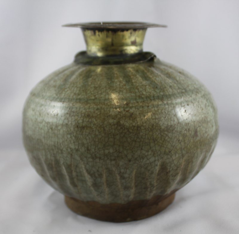 Good Sawankhalok, 15th Century, Celadon Vase,: with silvered lip and neck, above baluster body with fluted decoration to shoulders and lower base, exposed foot, h 15cm Provenance: Lucas Collection, Director Asian Art