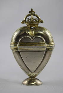 Danish Silver Hovedvansaeg (Spice Box), c.1734,: marked Jens Nielsen Randers, Denmark, parcel gilt heart shaped, with foliate engraved edges, on small oval foot, the hinged cover surmounted by a crown, total weight 40gm, h 7cm Purchased: Lawsons Auc