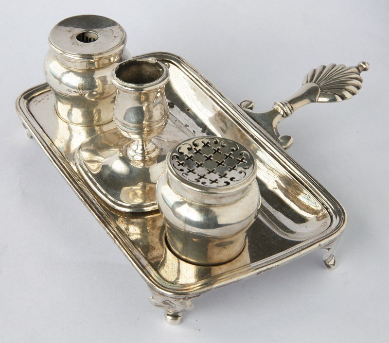 George II Sterling Silver Inkstand,: hallmarked London 1746, Edward Feline, rectangular dish with shell motif tab handle, the dish set with pen well, wafer well beneath the candle holder, baluster shaped inkwell and matching baluster sha