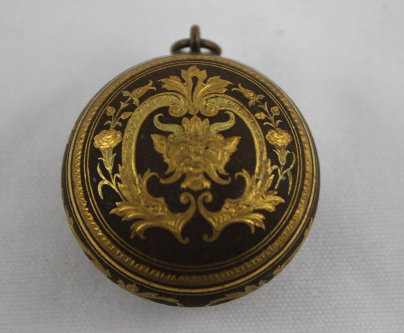 19 th Century Gilt Metal Pill Box,: of circular form, with baroque style mask within a cartouche, d 4cm