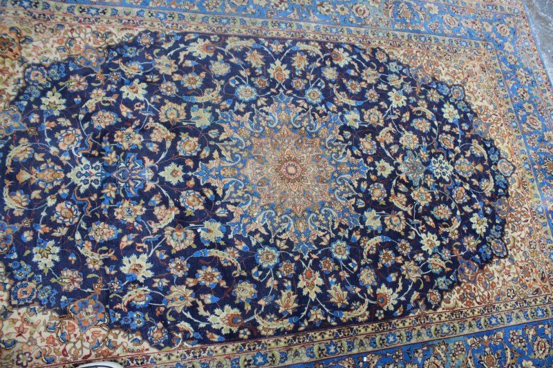 Fine Large Isfahan Rug,: of rectangular form, set with a central gull shaped medallion surrounded by trailing vines and flower heads, surrounded by similar boarders, in tones of blue, beige and iron red, 230cm x 150cm