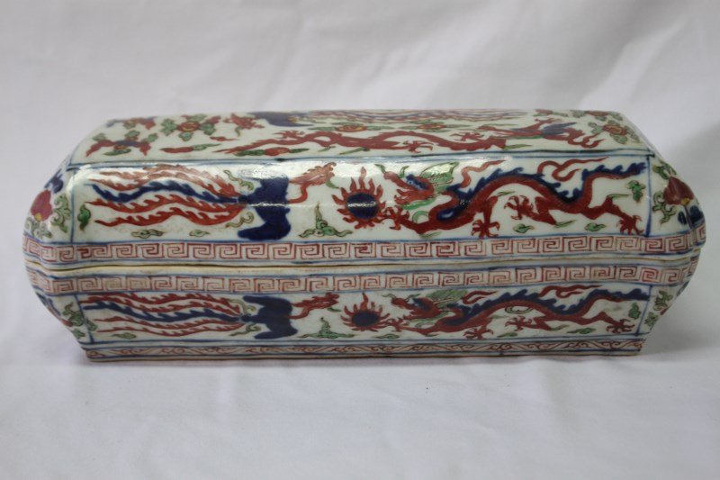 Chinese Porcelain Scholars Box and Cover,: of rectangular form, decorated with dragons and kylins amongst cloud scrolls in underglaze blue, green and red, the cover opening to two sectioned compartment, six character mark to base, l 31cm