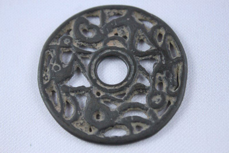 Chinese Bronze Reticulated Disk,: pierced design of two archaic dragons chasing a pearl, d 5cm.