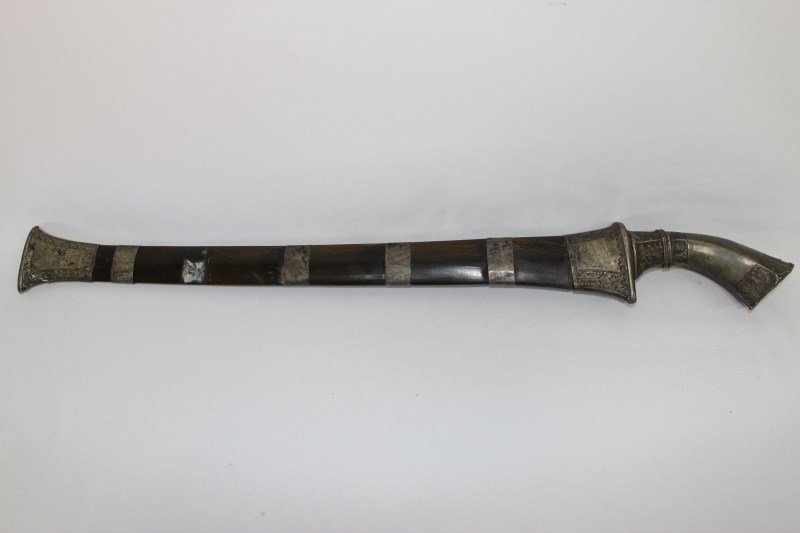 18th Century Dutch East India Company Sword,: typical cutlass form blade marked 'V.O.C' 1786, in Javanese mounts, with silver Klewang hilt, horn scabbard also with silver mounts. l 65cm.