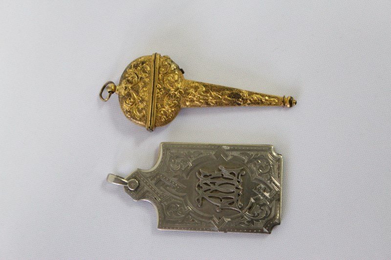 Two Chatelaine Accessories,: a gilt copper scissor case and an Edwardian silver plate and ivory note pad, monogrammed, (2)