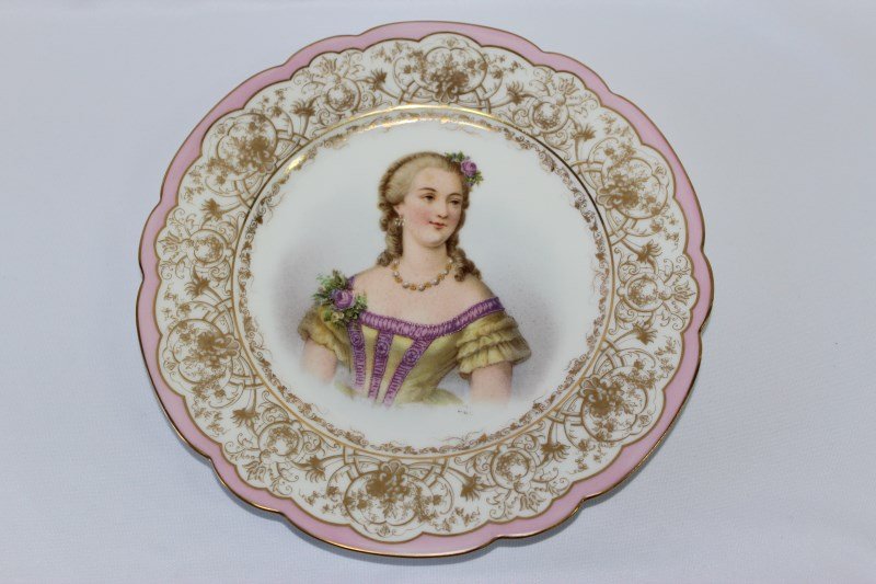 Sevres Porcelain Chateau Tuileries Portrait Plate,: of scalloped form, decorated with acentral portrait of Madame Du Barry, surrounded wiyh fine gilt work and pink boarder, d 24cm