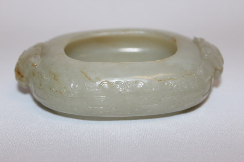 Good Chinese Jade Brush Washer,: of oval form, with curved edges, flanked by mythical masks to each ends, the body carved with toaist motifs on oval foot, l 10cm