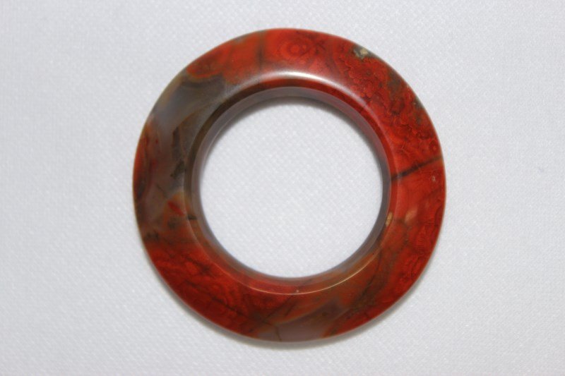 Early Chinese Agate Ring,: in tones of deep iron red and brown, d 5cm