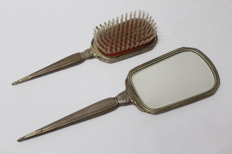 Art Deco Silver Dressing Table Set,: hand mirror and hair brush, both with engraved monogram 'D' and marked 'Sterling', (2)