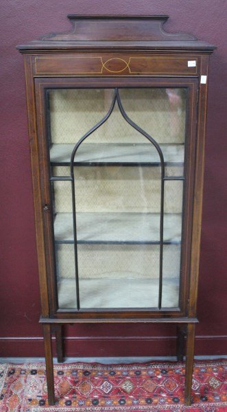 Edwardian Single Door Display Cabinet,: with stepped pediment with stringing to the edges, above a astragal door, opening to lined shelves, on four facetted tapered legs, 138cm x 61cm x 32cm