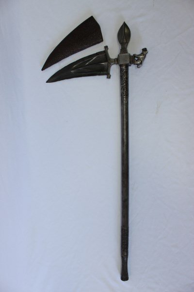 Indian 18th Century Mogul Zaghnal,: of all steel construction, the faceted haft with two bands of floral carving, the head of crystalline damascus steel, of curved triangular shape, twin lion head terminals, a squat, leaf form spear tip