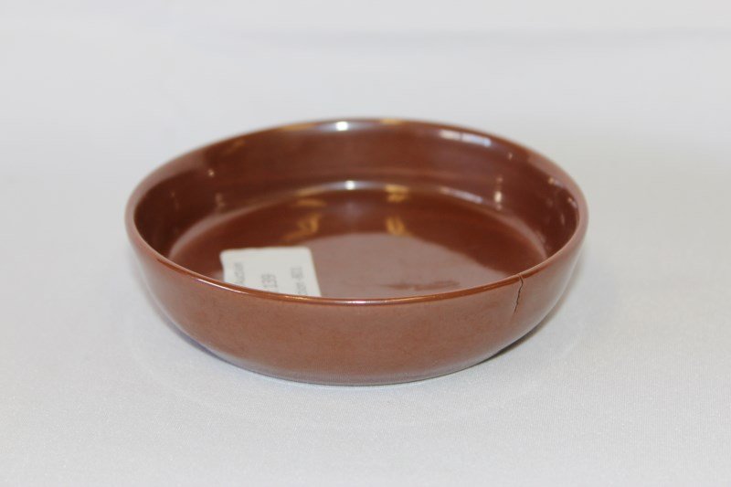 Small Chinese Porcelain Monochrome Dish,: of circular form, in a brown glaze, with slightly raised sides, six character mark to base, d 10.5cm a/f