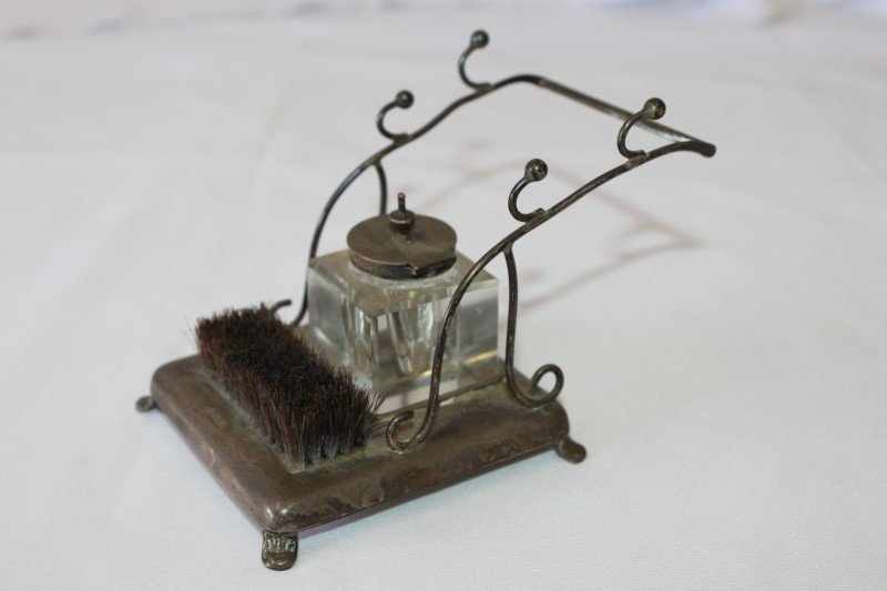 Delicate Edwardian Silver Desk Standish,: square crystal inkwell with hinged silver cover resting on a square base with wire frame pen rest and integral nib brush, raised on four feet, hallmarked Birmingham, 1906