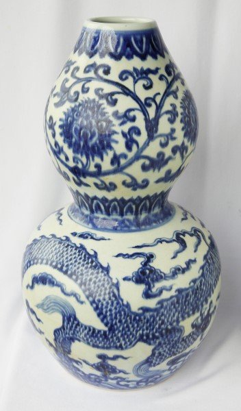 Chinese Blue and White Porcelain Vase,: gourd form vase decorated with sinuous Dragon flying in clouds above waves, all below a decorative scrolling floral band, with four character mark, h 41cm