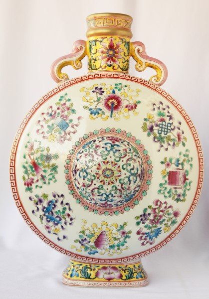 Chinese Porcelain Vase,: moon flask vase with twin handles decorated with famille rose with eight auspicious objects and floral designs, red seal mark to base, h 33cm