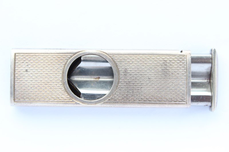 Silver Cigar Cutter,: hallmarked for Birmingham, 1983, with engine turned sides, total weight 13gms